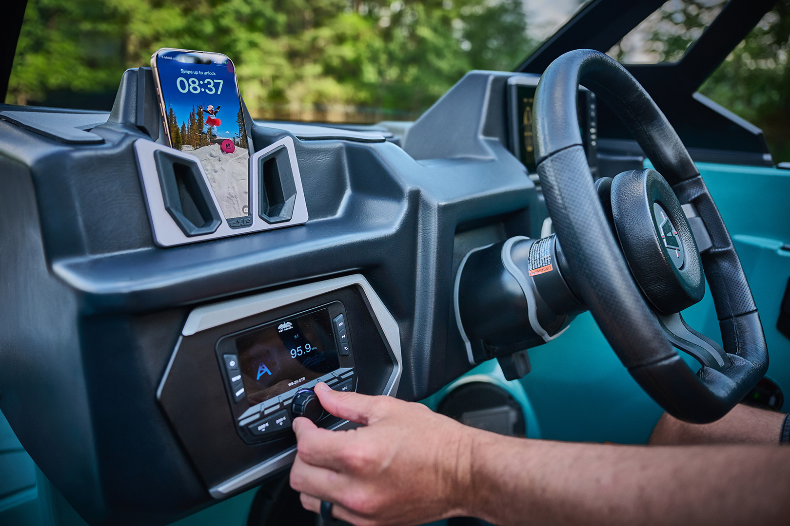 Close-up of Axis A200 rotary dial and wireless phone holder with active screen display.