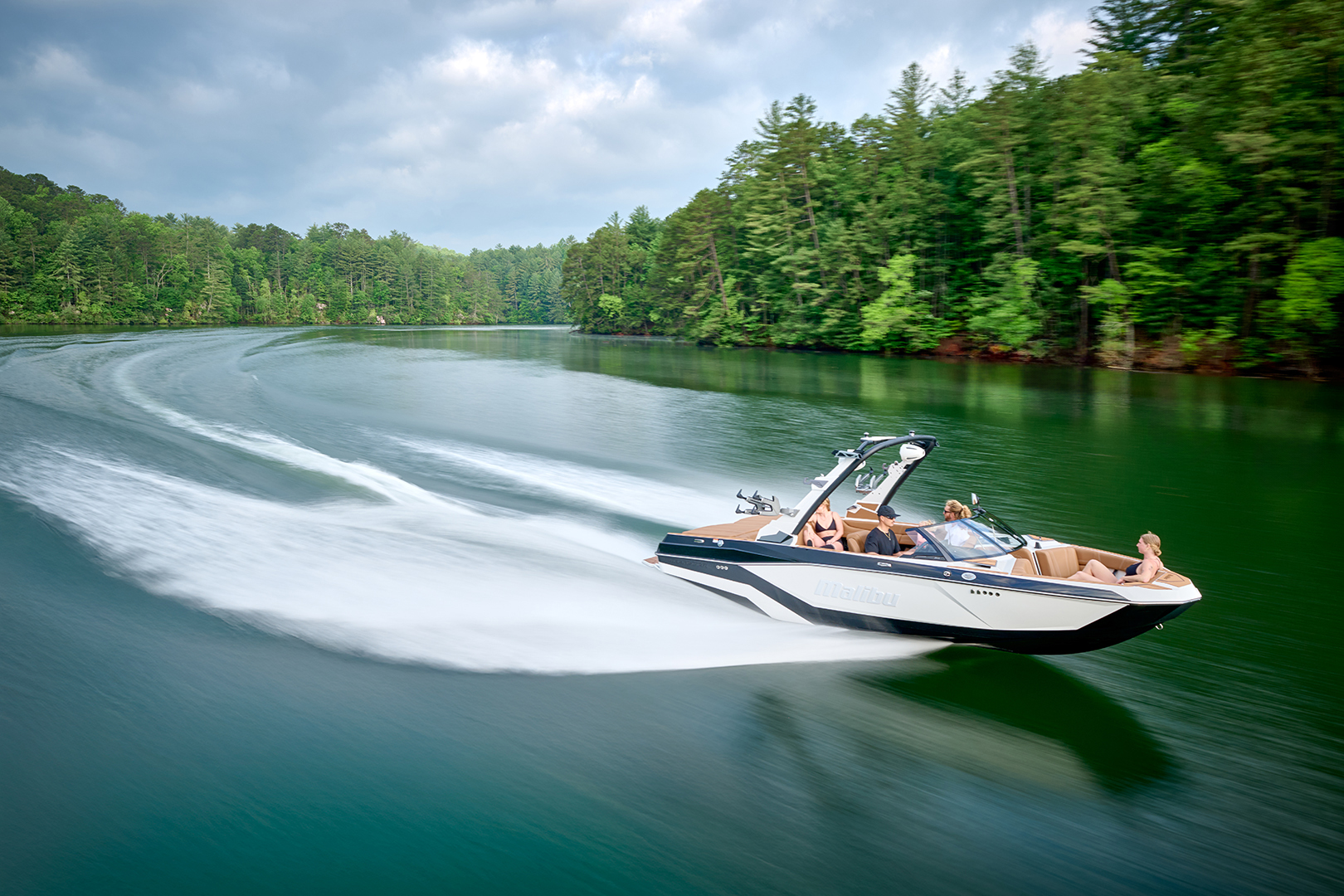 Overhead shot of the Malibu 21 LX with visible wake patterns behind.